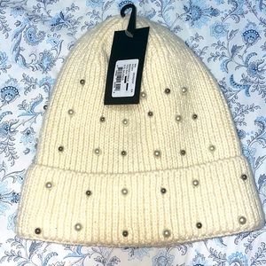 Beige hat with silver and white pearls. Never used. Brand new.